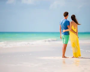 young-happy-couple-white-beach-summer-vacation_109800-<dfn class=